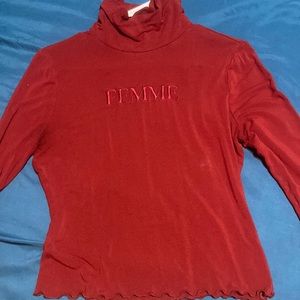 It is like a A burgundy color shirt it is a very silky material